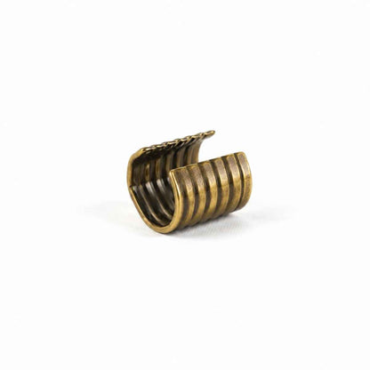 Grapa Embellecedora 216-12 para Cordones – 12 mm